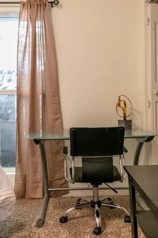 a living room with a couch and a window