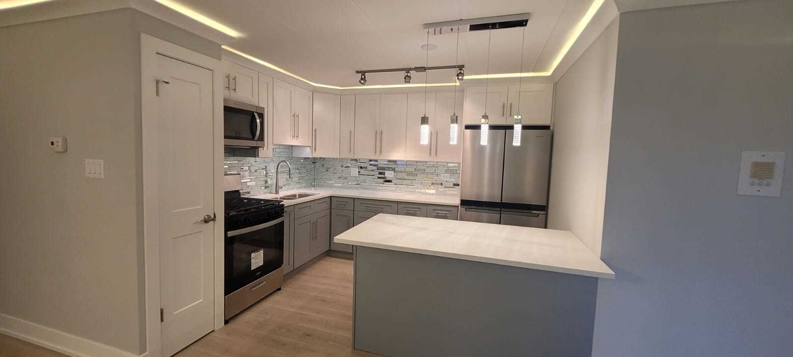 11024 Kilpatrick Avenue, Unit 3 Oak Lawn, IL 60453 - Photo 8 of 9 a kitchen with stainless steel appliances a refrigerator stove and sink