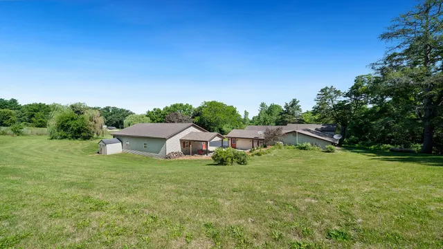 a backyard of a house with lots of green space