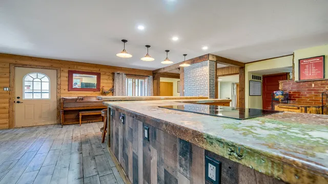 a kitchen with stove and cabinets