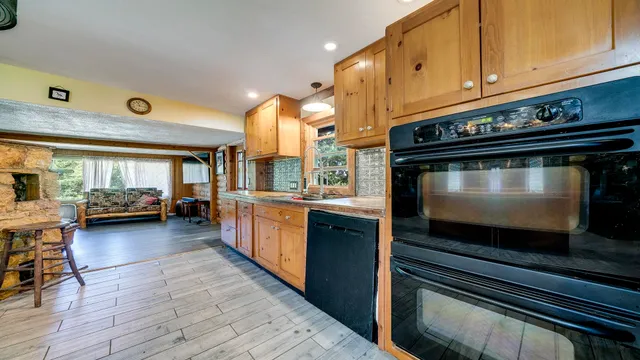a kitchen with a refrigerator and a sink