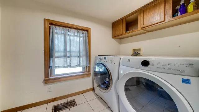 a bedroom with furniture wooden floor and a fireplace