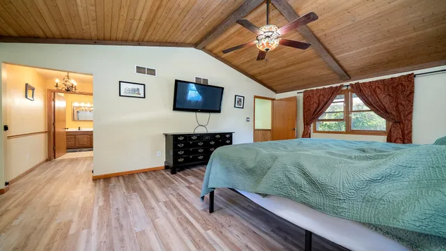a bathroom with a sink a mirror and a shower