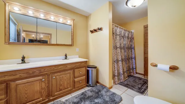 a bedroom with furniture and a flat screen tv