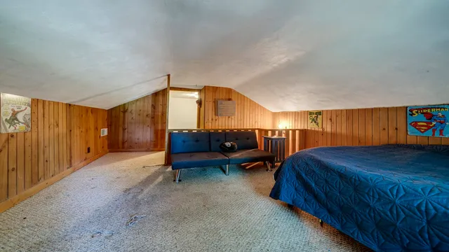 a view of walk in closet with clothes