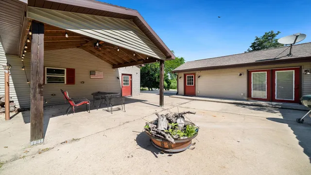 a view of a backyard with a patio
