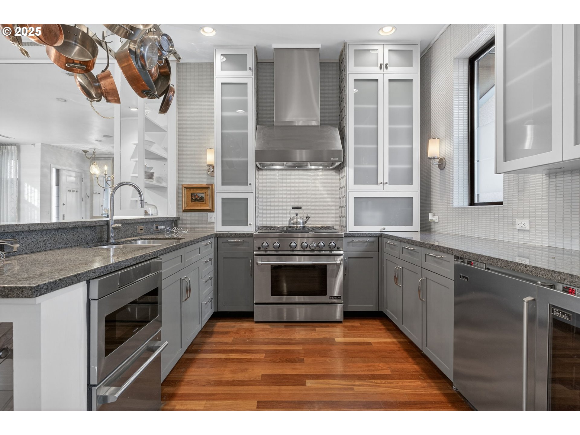 2018 Northwest 16th Avenue Portland, OR 97209 - Photo 11 of 48 a kitchen with stainless steel appliances granite countertop a stove a sink and a granite counter tops