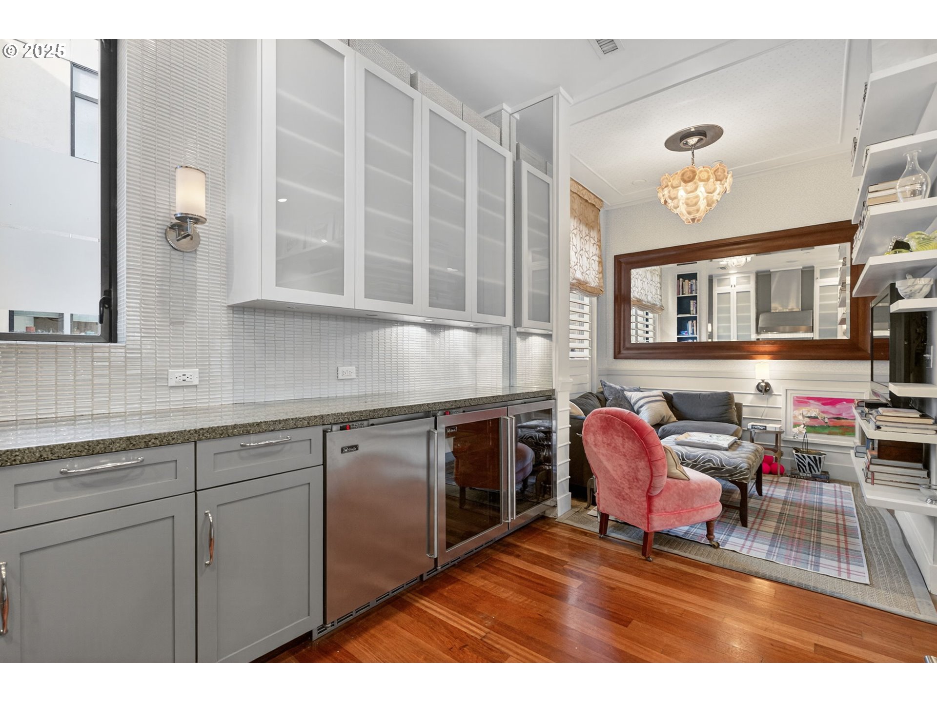 2018 Northwest 16th Avenue Portland, OR 97209 - Photo 13 of 48 a living room with furniture a chandelier and kitchen view