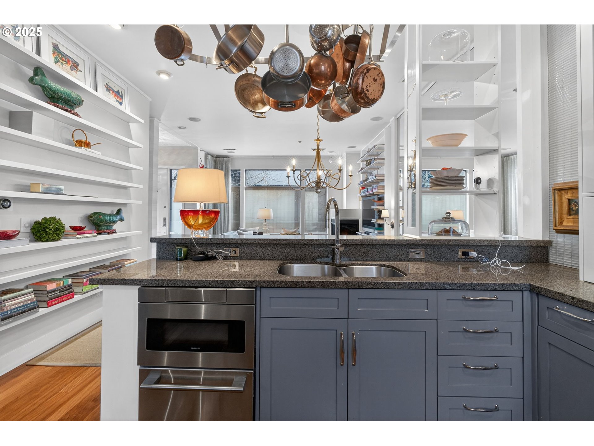 2018 Northwest 16th Avenue Portland, OR 97209 - Photo 14 of 48 a kitchen with a sink and a stove with wooden floor