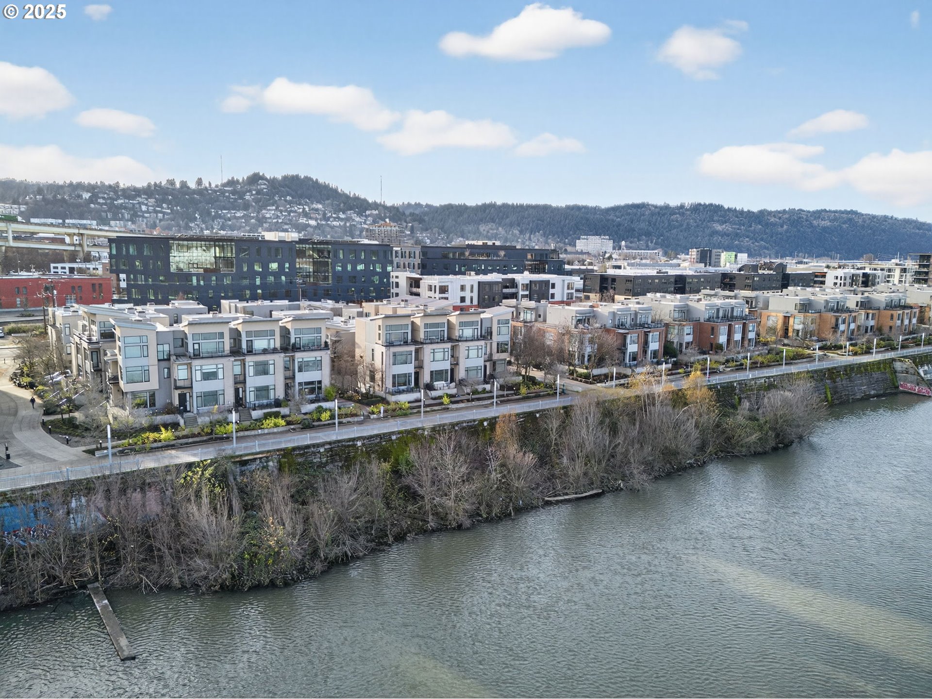 2018 Northwest 16th Avenue Portland, OR 97209 - Photo 44 of 48 a view of a lake with a city