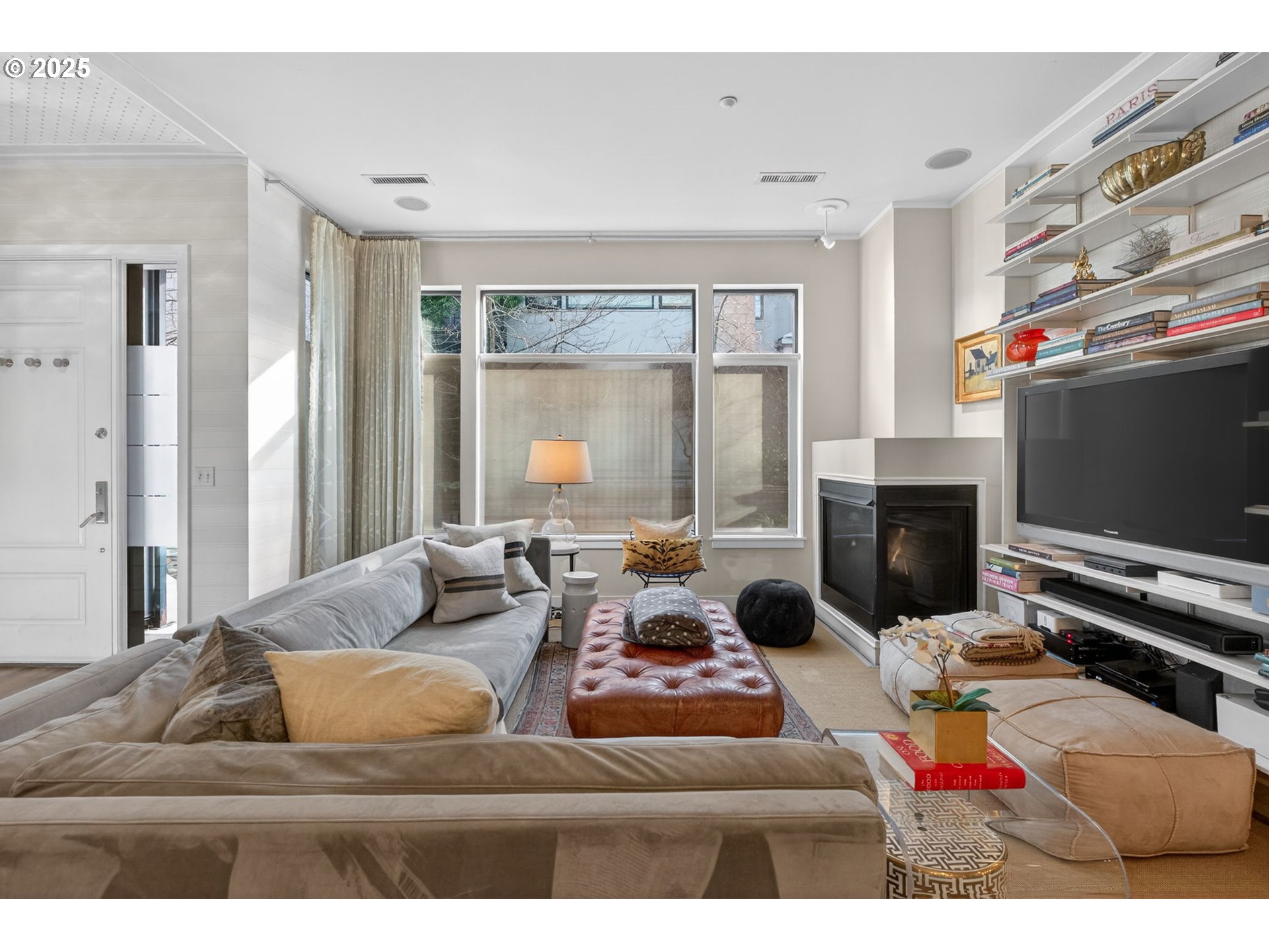 2018 Northwest 16th Avenue Portland, OR 97209 - Photo 6 of 48 a living room with furniture and a flat screen tv