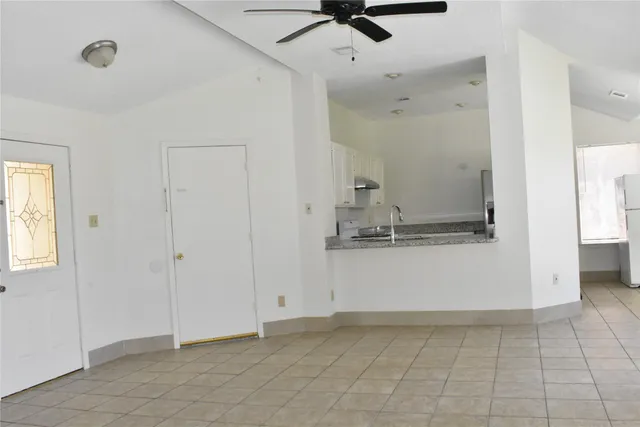 a view of a kitchen with a sink