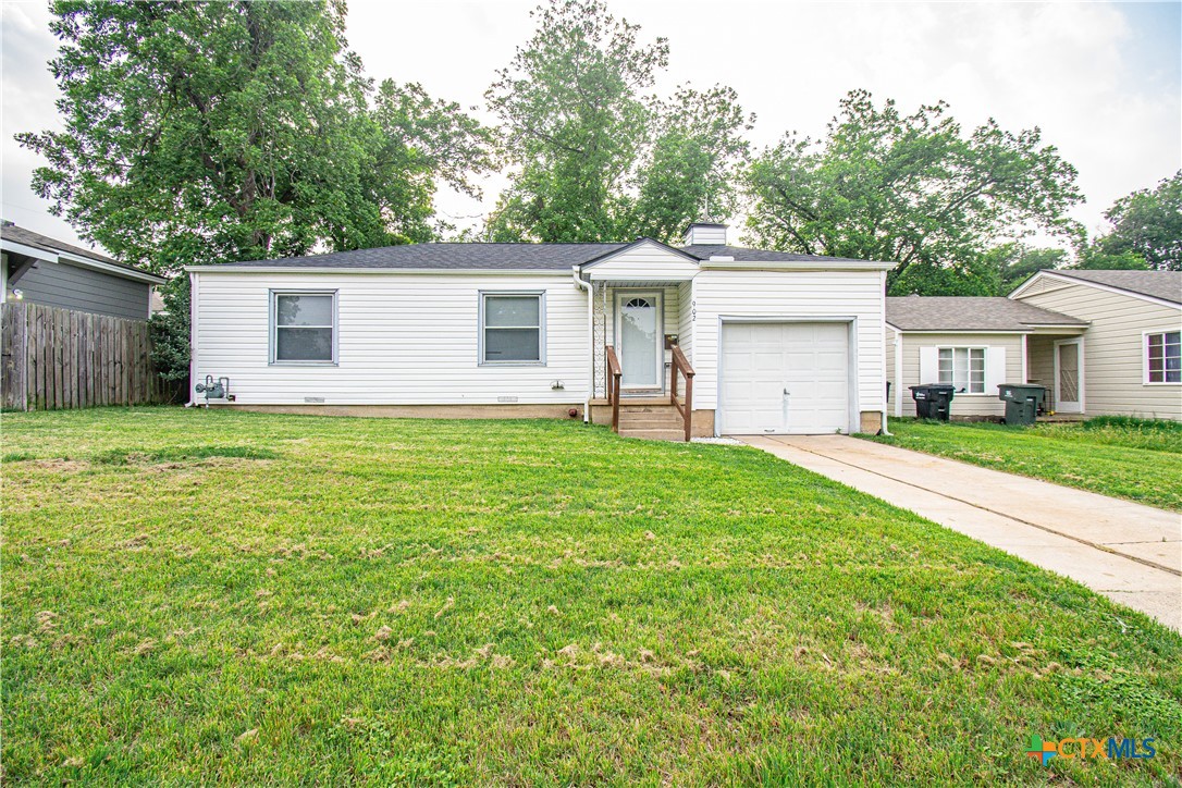 902 North 8th Street Temple, TX 76501 - Photo 1 of 20 a house view with a sitting space and garden