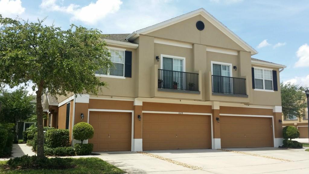 6638 South Goldenrod Road, Unit 117B Orlando, FL 32822 - Photo 1 of 1 a front view of a house with a garage