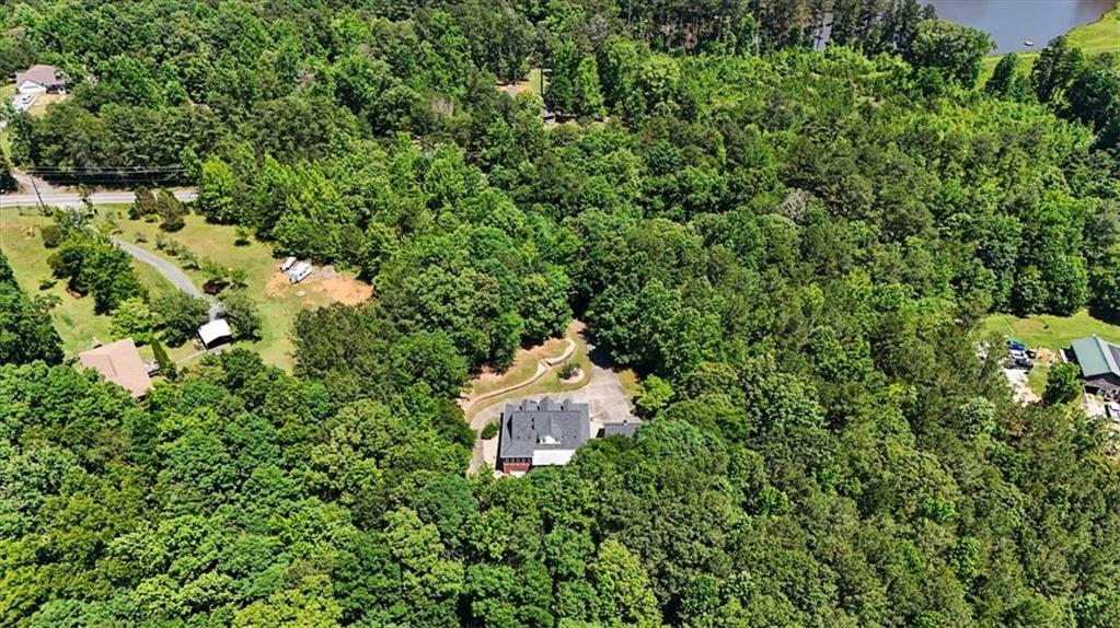 1136 Cole Lake Road Dallas, GA 30157 - Photo 70 of 72 an aerial view of a house with a yard