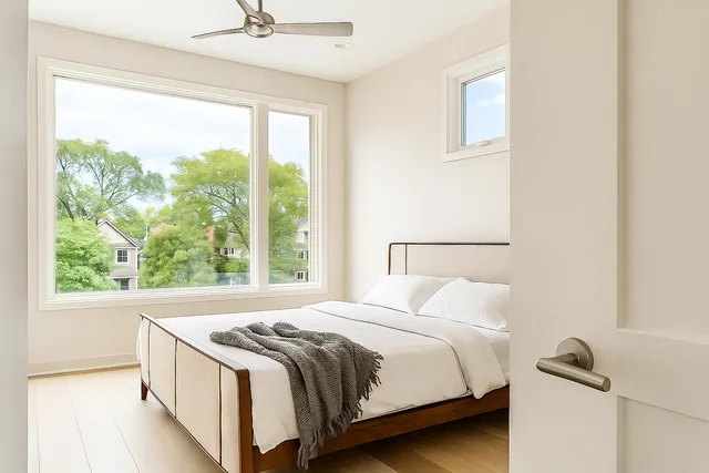 a bedroom with a bed and a window