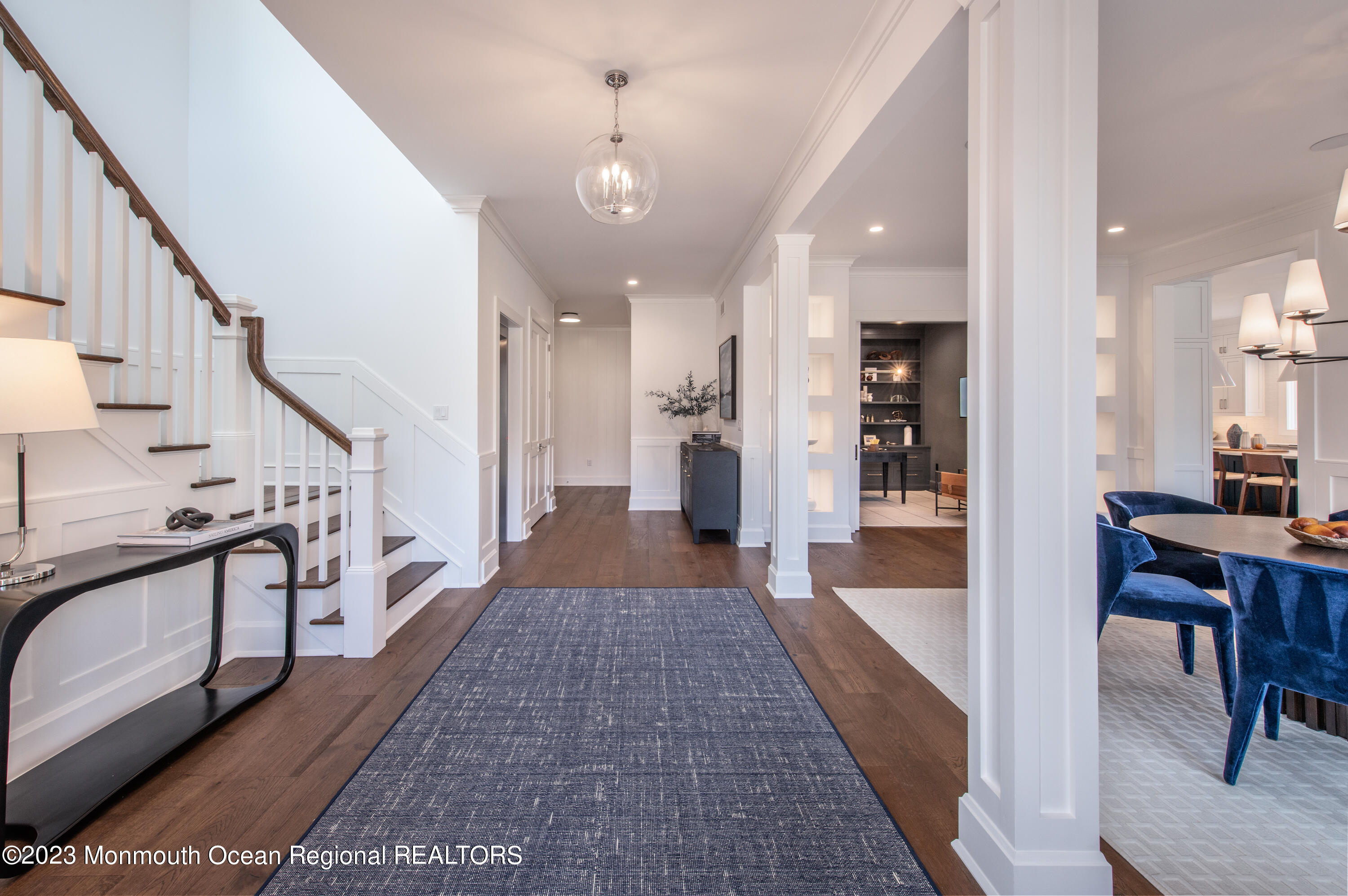 25 Bingham Avenue Rumson, NJ 07760 - Photo 2 of 21 a view of a hallway to a livingroom with furniture and stairs
