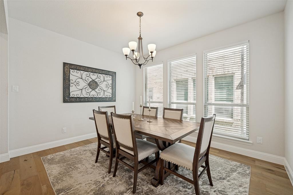 8440 Colburn The Colony, TX 75056 - Photo 7 of 34 This inviting dining area offers a bright and airy atmosphere, perfect for everyday meals or hosting special gatherings.