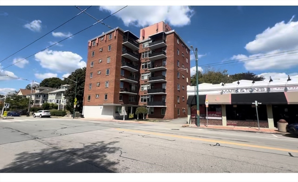 125 Trapelo Road, Unit 21 Belmont, MA 02478 - Photo 15 of 19 a view of a building with a street
