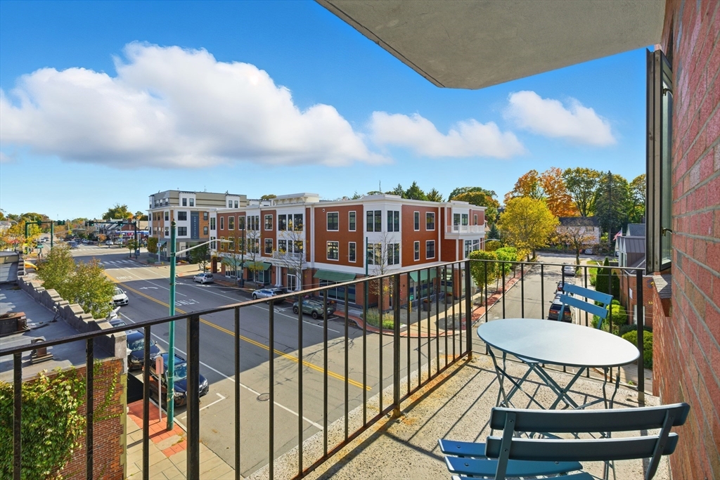 125 Trapelo Road, Unit 21 Belmont, MA 02478 - Photo 9 of 19 a view of a balcony with chairs