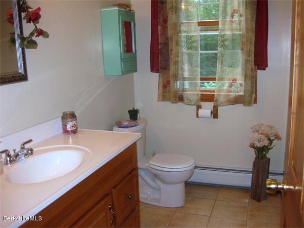 78 Maynard Road Chester, MA 01011 - Photo 22 of 36 a bathroom with a sink toilet and shower