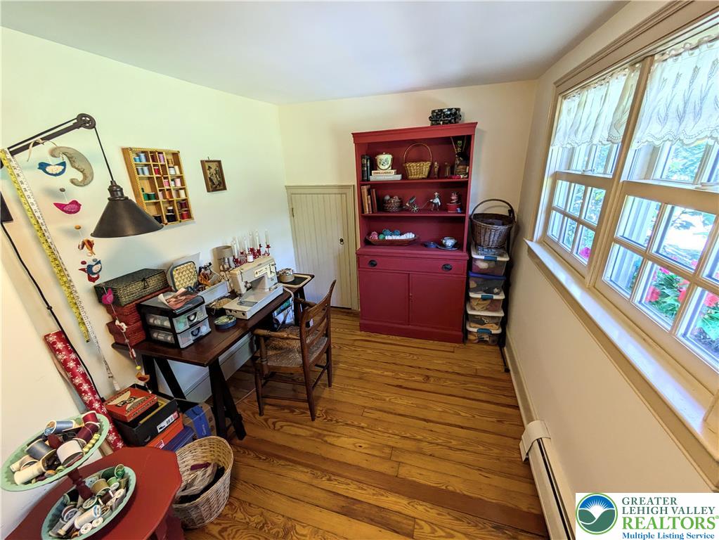 1731 Howell Road Easton, PA 18040 - Photo 28 of 60 Warm wood floors and classic wood-framed windows highlight this versatile utility and workspace.