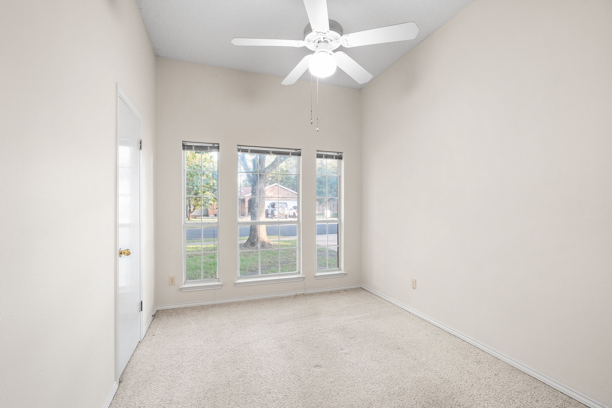 2802 Alexander Drive Leander, TX 78641 - Photo 19 of 29 Secondary bedroom with large windows looking out into the shaded front yard (south facing).