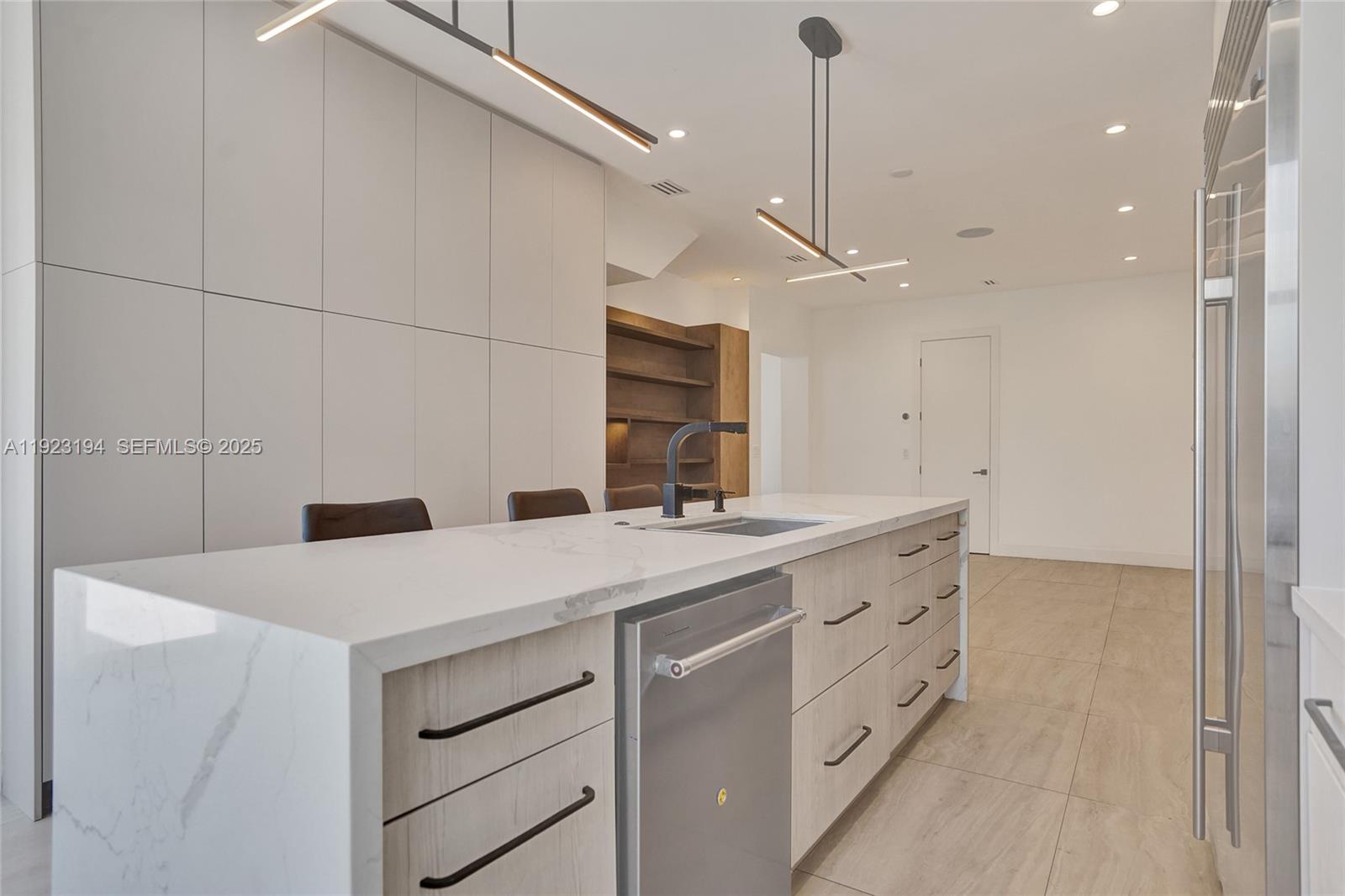 3757 Northeast 208th Terrace Aventura, FL 33180 - Photo 14 of 74 a kitchen with a sink and a refrigerator
