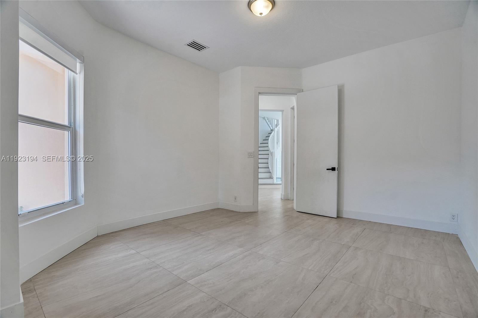 3757 Northeast 208th Terrace Aventura, FL 33180 - Photo 22 of 74 an empty room with windows and closet