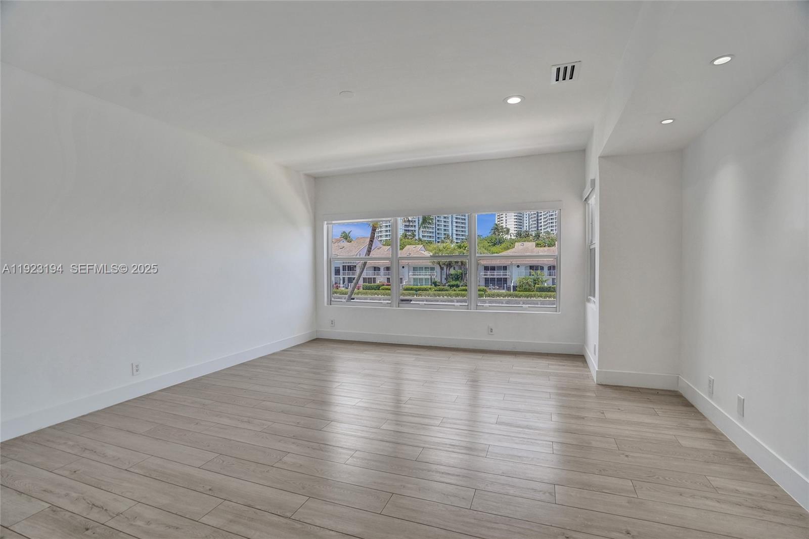 3757 Northeast 208th Terrace Aventura, FL 33180 - Photo 26 of 74 a view of an empty room with a window