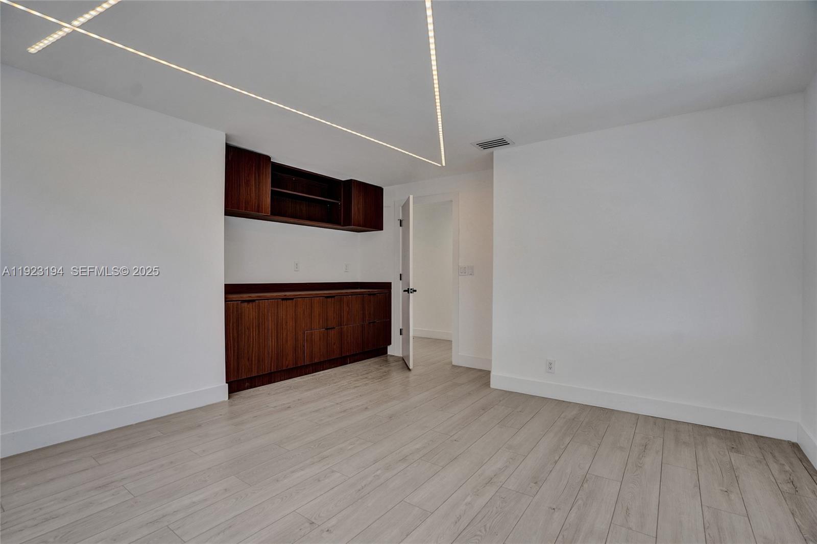 3757 Northeast 208th Terrace Aventura, FL 33180 - Photo 38 of 74 a view of empty room with wooden floor