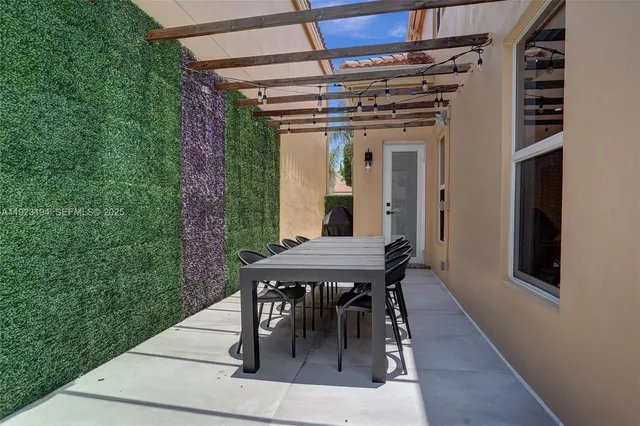 an aerial view of a houses and an outdoor space