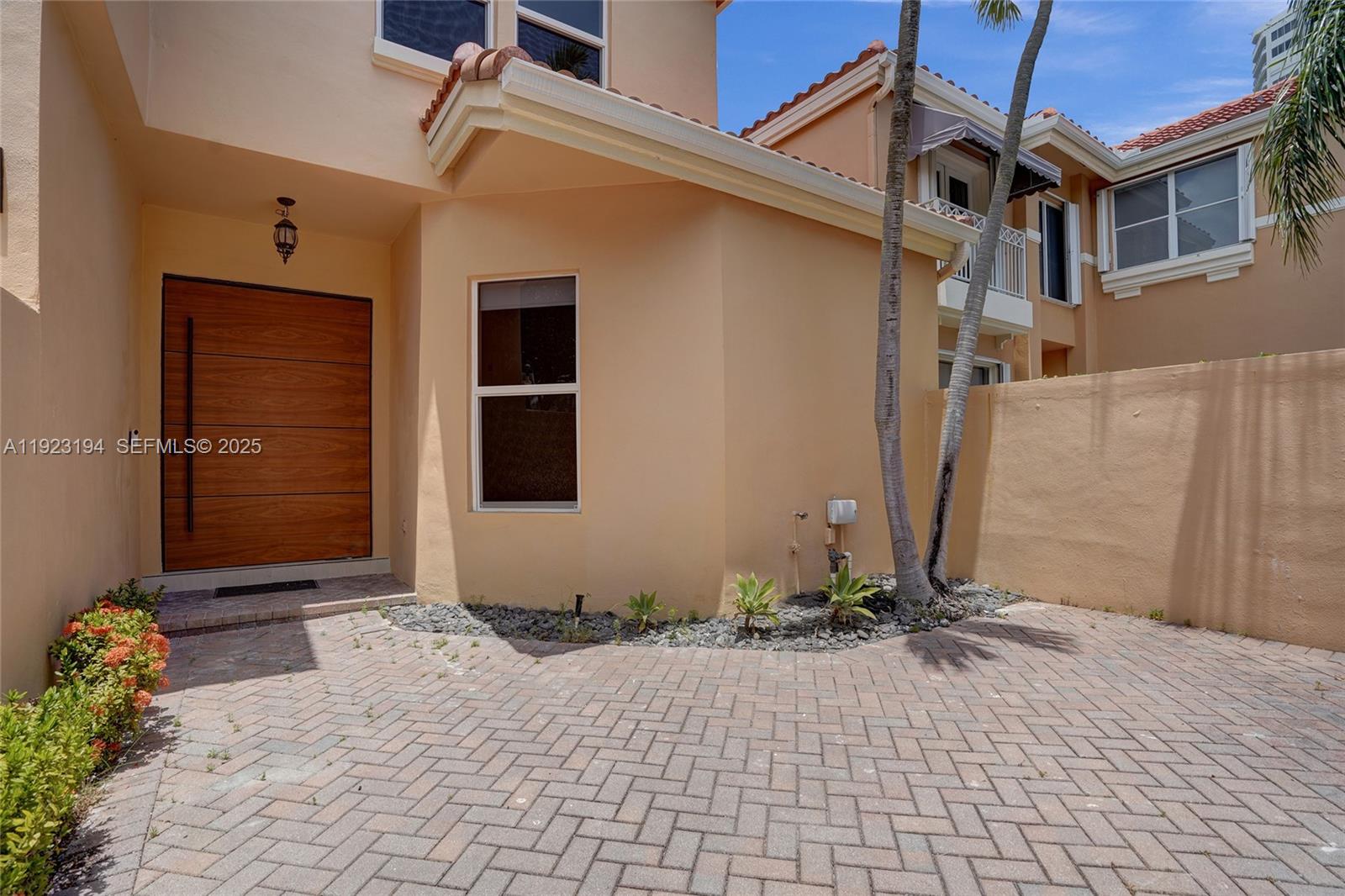 3757 Northeast 208th Terrace Aventura, FL 33180 - Photo 59 of 74 a front view of a house