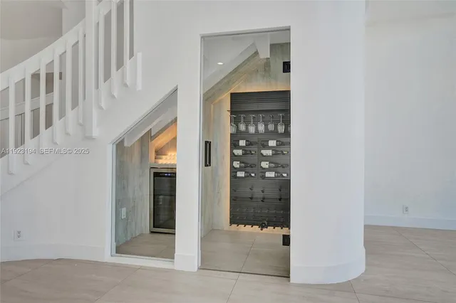 a kitchen with stainless steel appliances granite countertop a sink a stove and a refrigerator