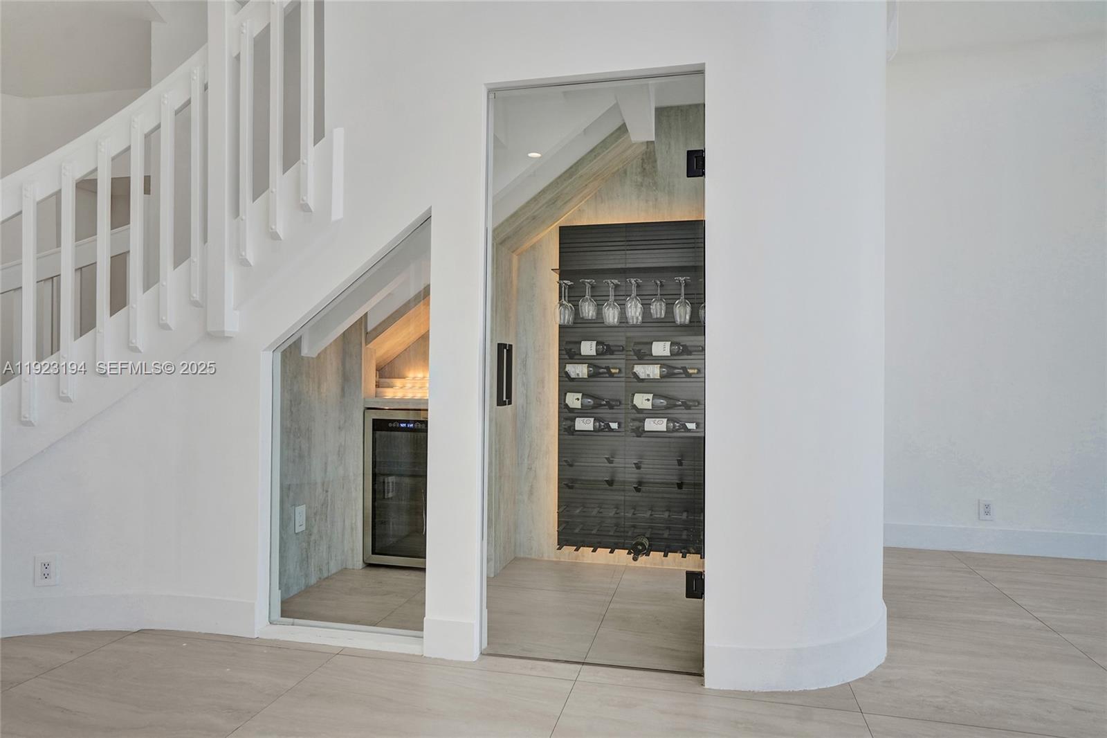 3757 Northeast 208th Terrace Aventura, FL 33180 - Photo 8 of 74 a view of staircase with white door and door