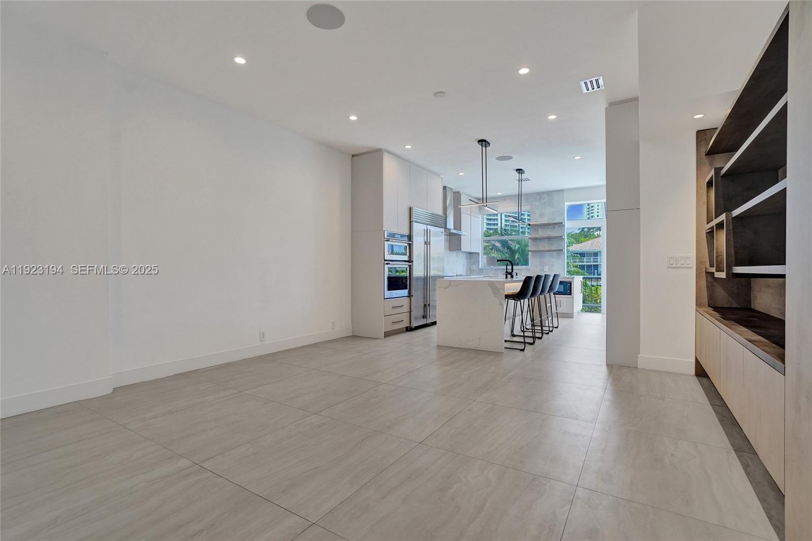 3757 Northeast 208th Terrace Aventura, FL 33180 - Photo 9 of 74 a view of kitchen with furniture and wooden floor