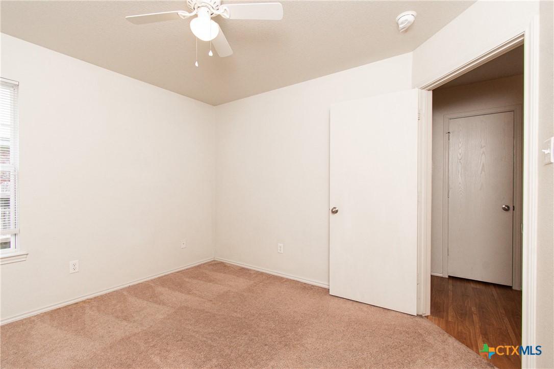 6509 Temora Loop, Unit A Killeen, TX 76549 - Photo 9 of 19 a view of a livingroom with a ceiling fan and window