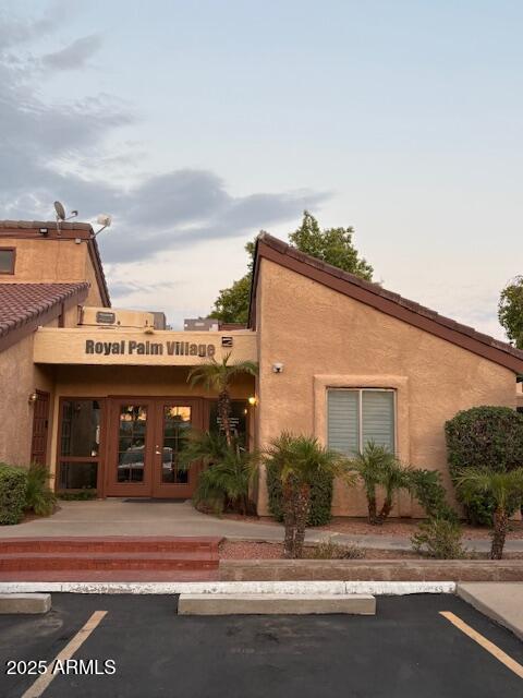 2121 West Royal Palm Road, Unit 2074 Phoenix, AZ 85021 - Photo 16 of 22 a view of a house with a yard