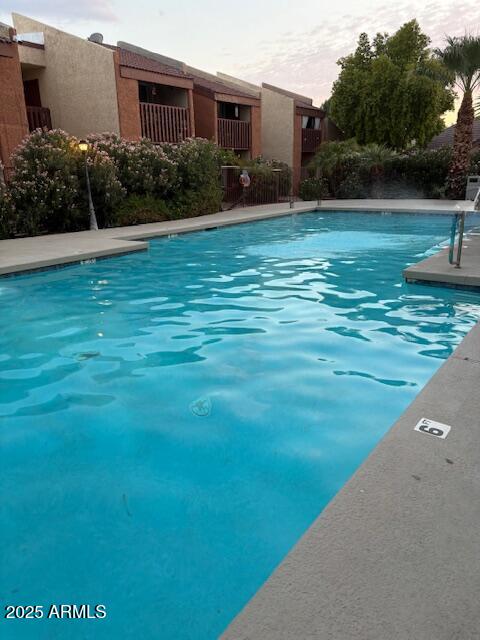 2121 West Royal Palm Road, Unit 2074 Phoenix, AZ 85021 - Photo 17 of 22 a view of a garden and basketball court