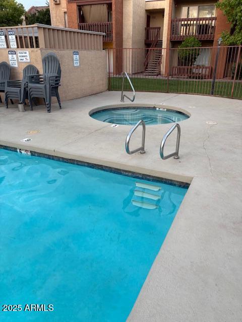 2121 West Royal Palm Road, Unit 2074 Phoenix, AZ 85021 - Photo 18 of 22 swimming pool view with seating space