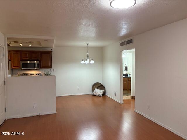 2121 West Royal Palm Road, Unit 2074 Phoenix, AZ 85021 - Photo 4 of 22 a view of a room with wooden floor and a window