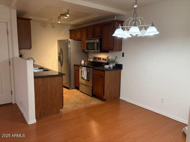 2121 West Royal Palm Road, Unit 2074 Phoenix, AZ 85021 - Photo 6 of 22 a kitchen with stainless steel appliances granite countertop a refrigerator a stove top oven a sink and dishwasher