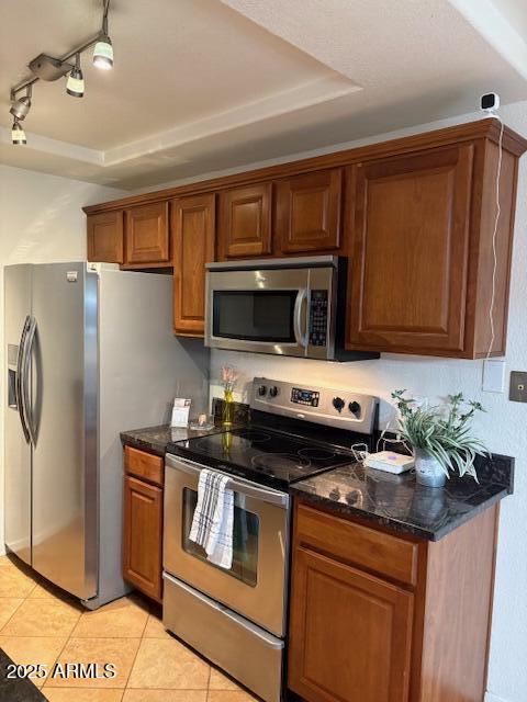 2121 West Royal Palm Road, Unit 2074 Phoenix, AZ 85021 - Photo 7 of 22 a kitchen with stainless steel appliances a stove microwave and refrigerator