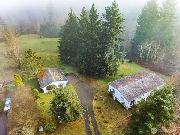 a aerial view of a house with a yard