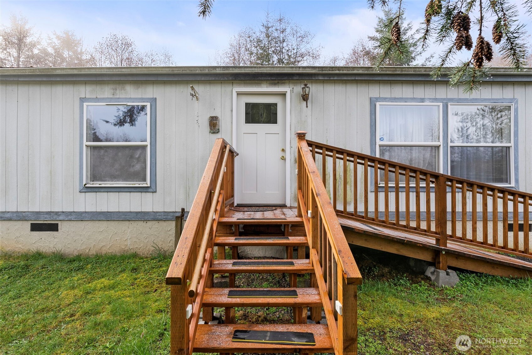 104 Sun Valley Drive Chehalis, WA 98532 - Photo 4 of 29 a view of a yard with wooden deck and a lake view