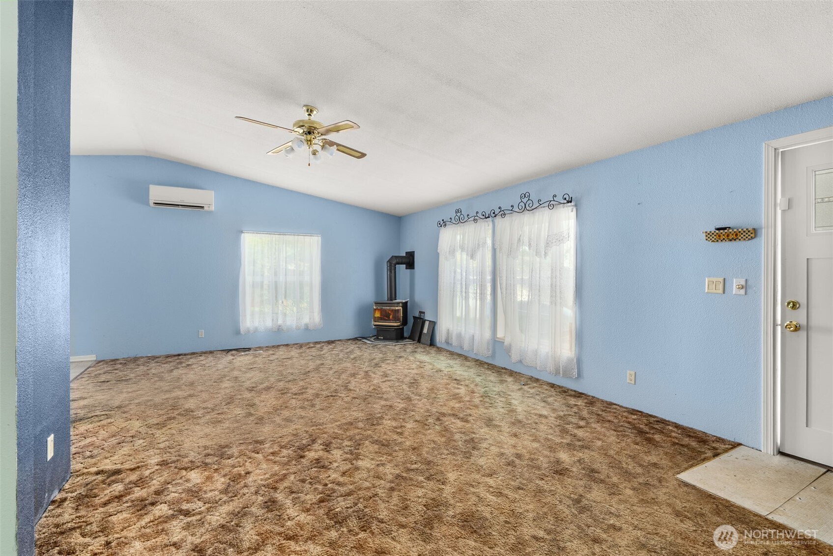 104 Sun Valley Drive Chehalis, WA 98532 - Photo 6 of 29 a view of a bedroom with windows and ceiling fan