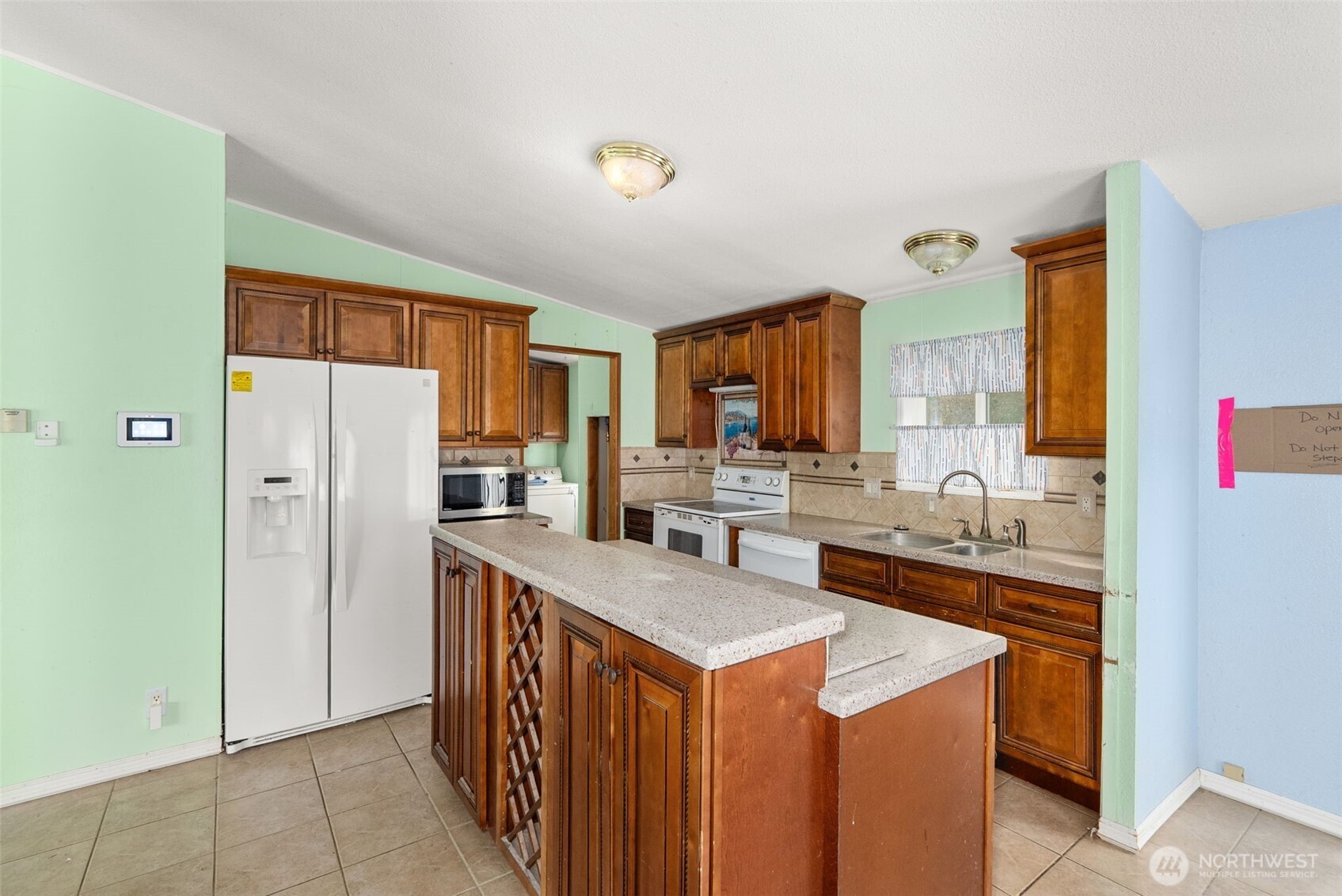 104 Sun Valley Drive Chehalis, WA 98532 - Photo 8 of 29 a kitchen with stainless steel appliances a sink stove and refrigerator