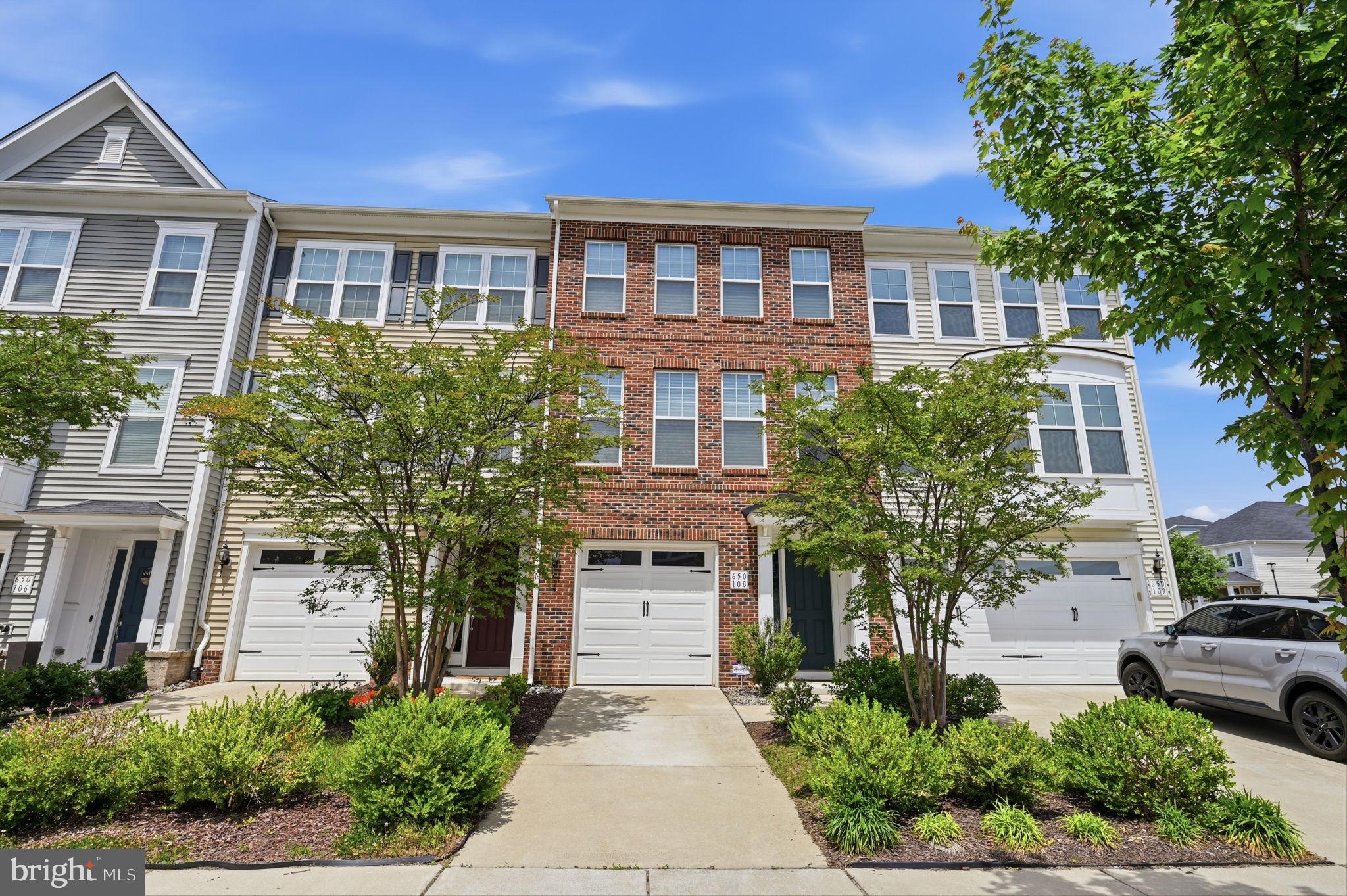 650 Aspen Road, Unit 108 Stafford, VA 22554 - Photo 2 of 26 Charming townhomes with lush greenery.