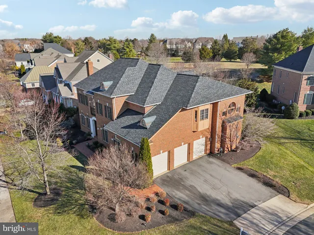 a view of a livingroom with wooden floor and furniture