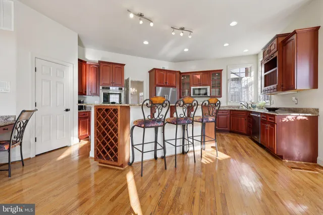 a living room with furniture ceiling fan and a window